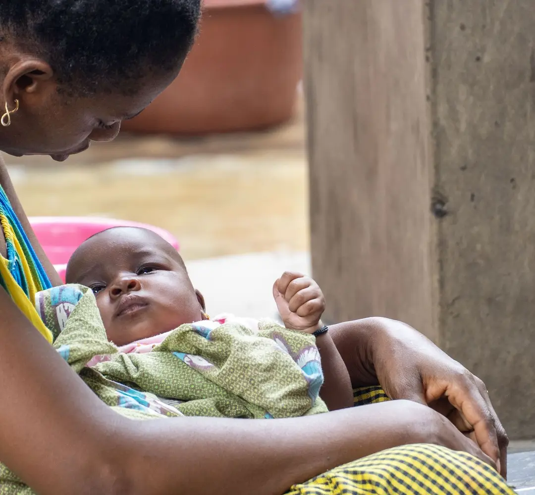 Photo of a mother holding a baby in Senegal