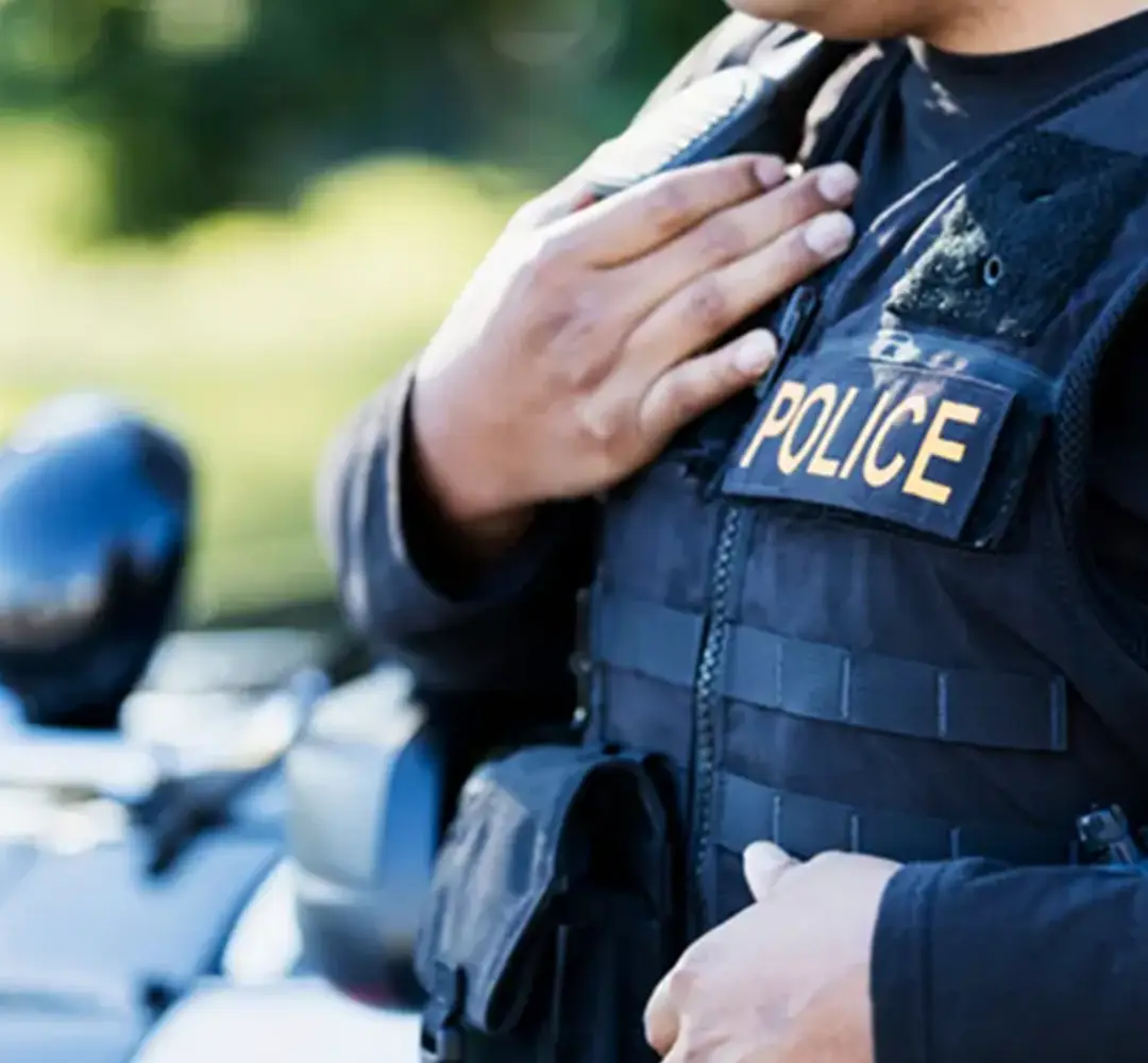 A closeup of a police officer's vest.