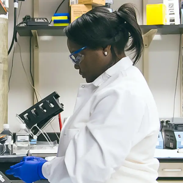 A technician works in the lab