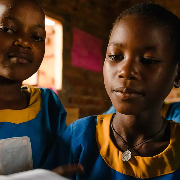Ugandan students participate in reading class