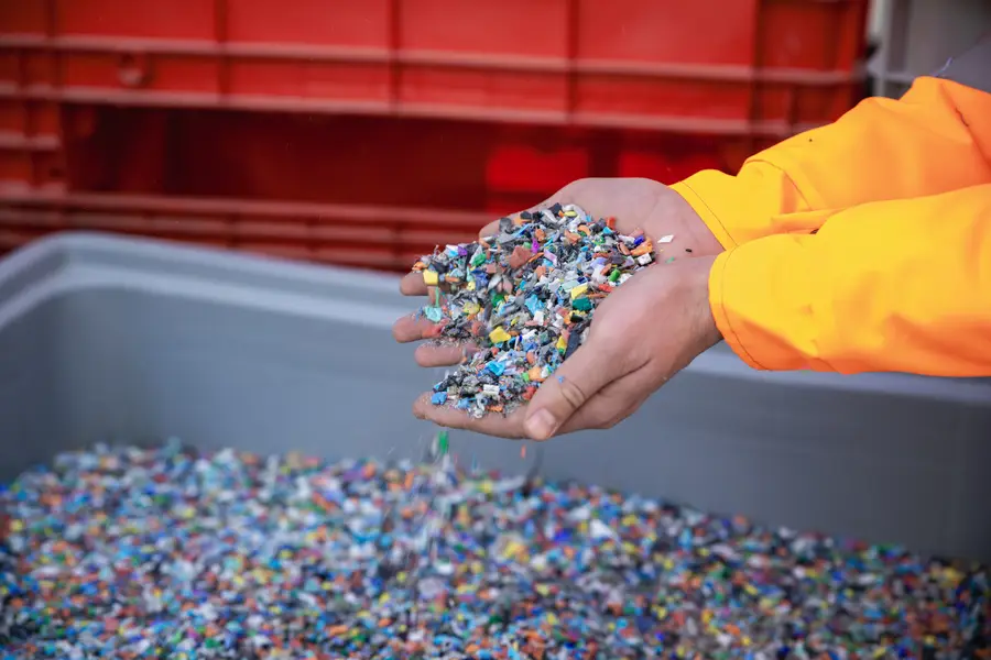 Hands holding small pieces of plastic