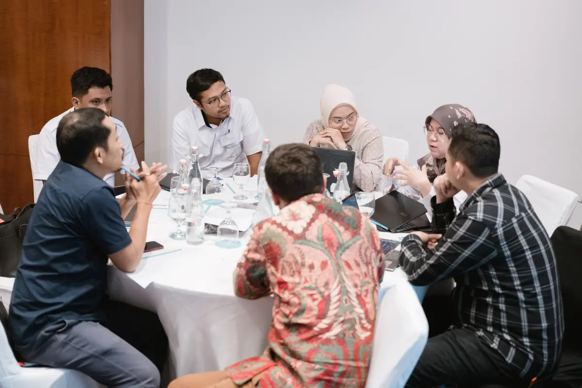 People gathered around a table talking