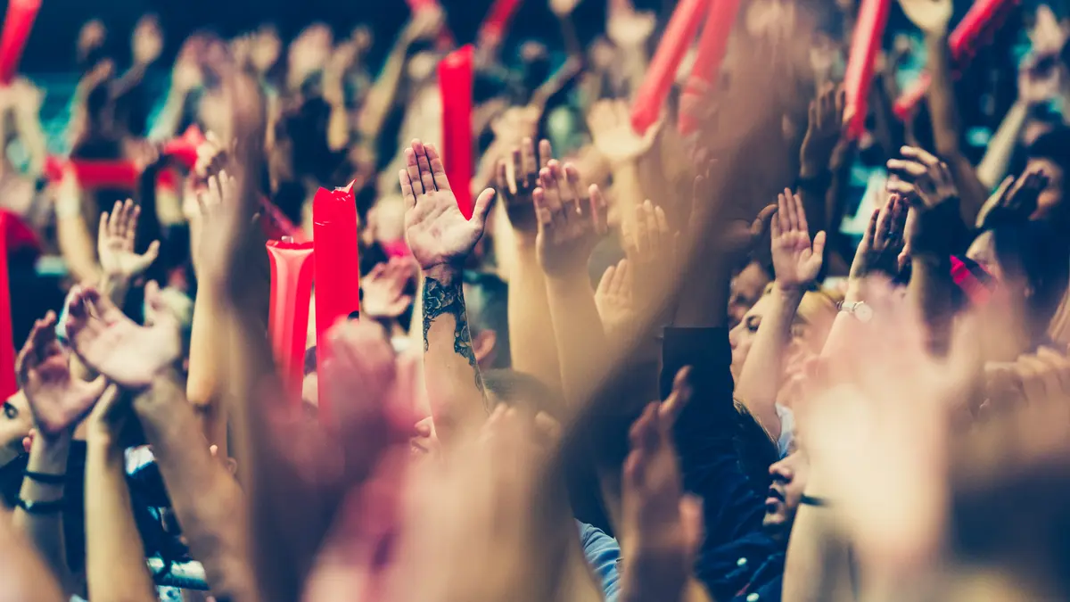 hands clapping in a stadium
