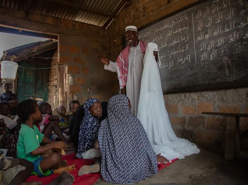 an Imam teaching about proper use of LLINs