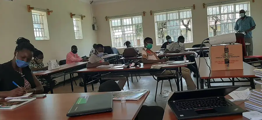 Village health teams in Uganda are trained before treatment campaigns begin, including new training on COVID-19 protocols.  