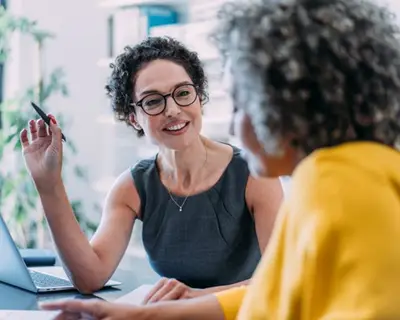 Consultant talks to client in office