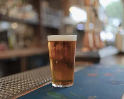 Full glass of beer on countertop