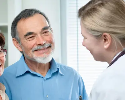 doctor speaking with patients
