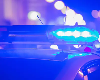 police car lights flashing at night