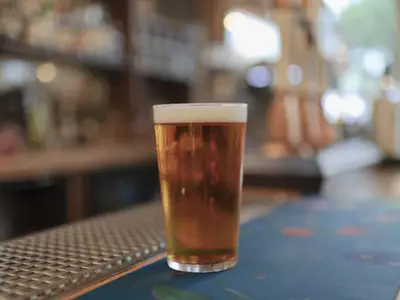 Full glass of beer on countertop