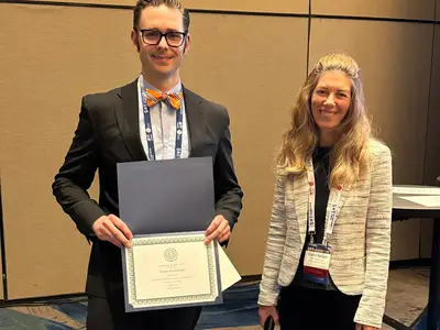 Dr. McCullough (left) receives "Best Paper of the Year" honor from the Regulatory and Safety Evaluation Specialty Section at the 64th Annual Meeting of the Society of Toxicology (photo by Dr. Erin Huber)
