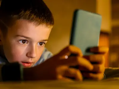 Child looking at smartphone