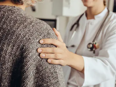 Doctor comforts patient