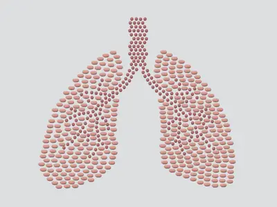 Illustration of pills in the shape of a human lungs.