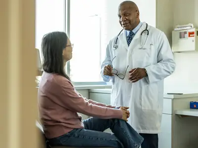 Doctor consults patient