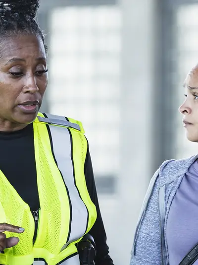 Female police officer talking to a woman