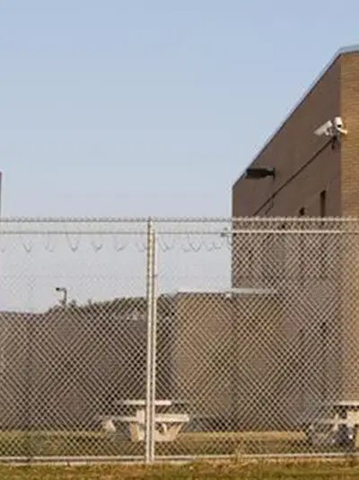 Fence with prison building