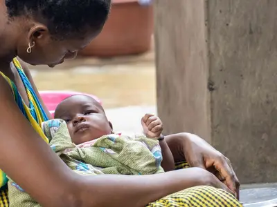 Photo of a mother holding a baby in Senegal