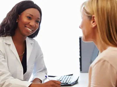 A patient having a consultation with a female doctor