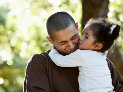 father hugging daughter