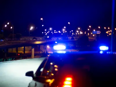 Police lights with city in backdrop