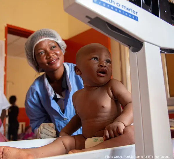 A baby in Guinea receives care from the StopPalu program.