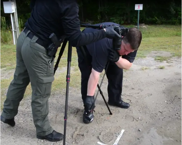 officers collecting footwear impression evidence