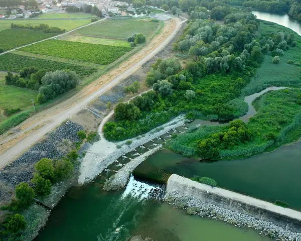 An aerial photo of a reservoir and river dam
