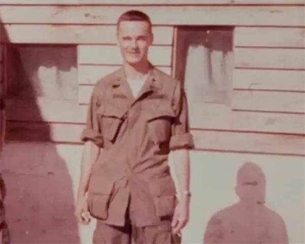 Thomas Johnson wearing a brown combat uniform
