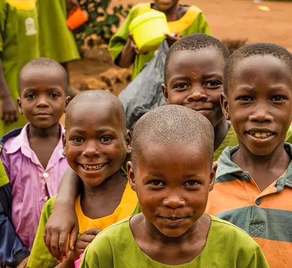 Students gather for an English reading lesson in Masaka, Uganda. They are just some of 4+ million students across the country who are learning to love reading thanks to two early grade reading programs funded by USAID and implemented by RTI International