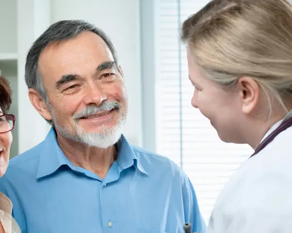 doctor speaking with patients