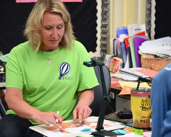 female educator working with protractor