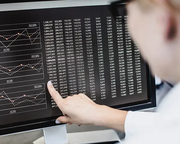 A scientist reviews data on a computer screen.
