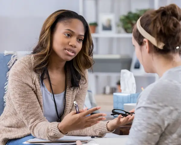 Counselor speaking with her client