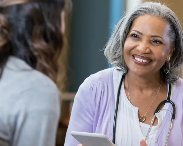 Doctor discussing care plans with her patient