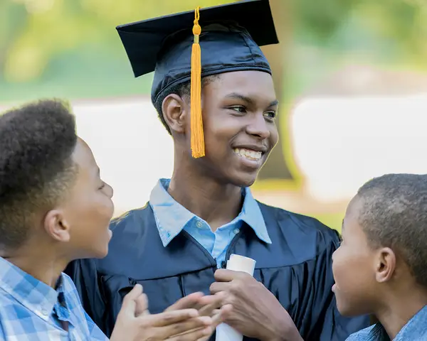 Teens celebrate their brother's graduation