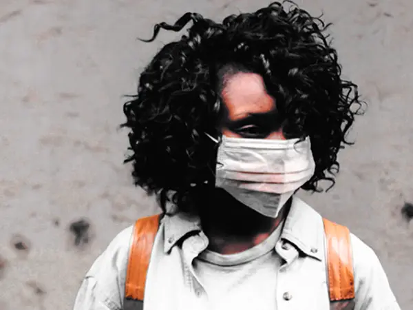 Woman in Nairobi wearing a mask to protect herself and others from COVID-19