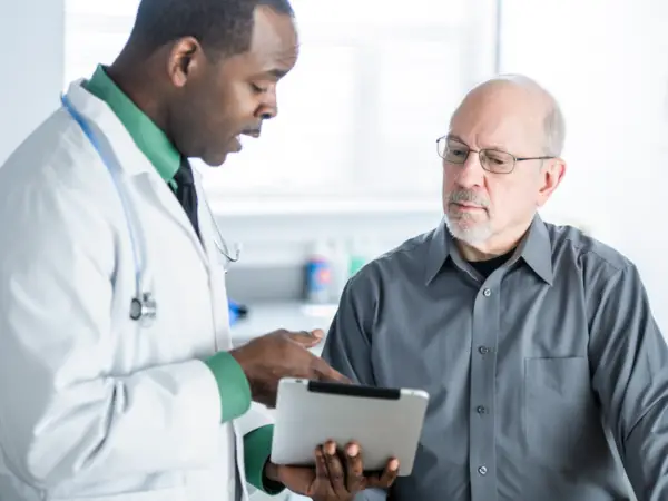 Doctor speaks to patient